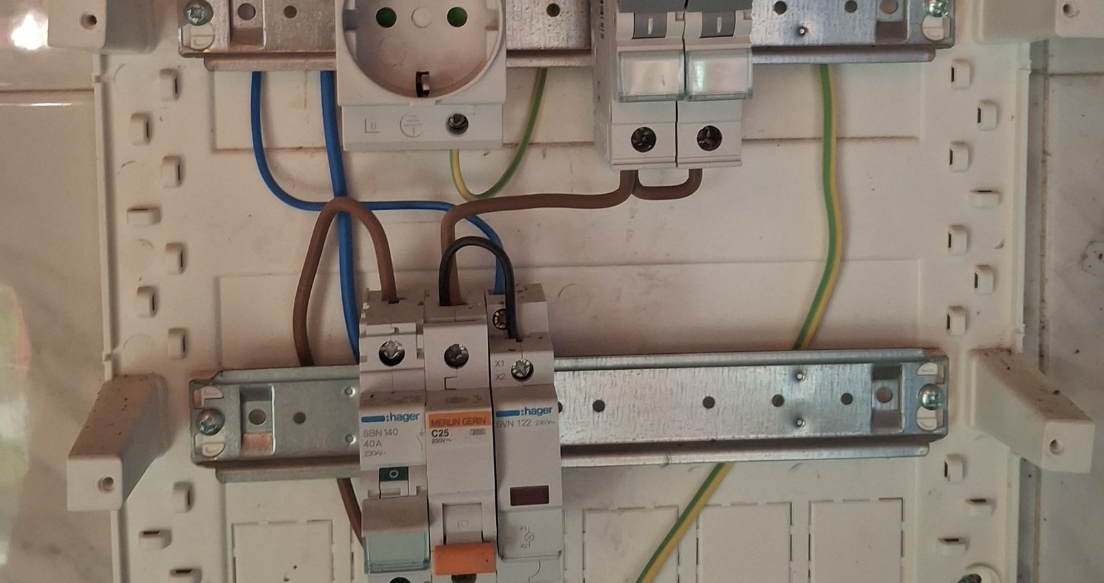 Open electrical distribution board during wiring work