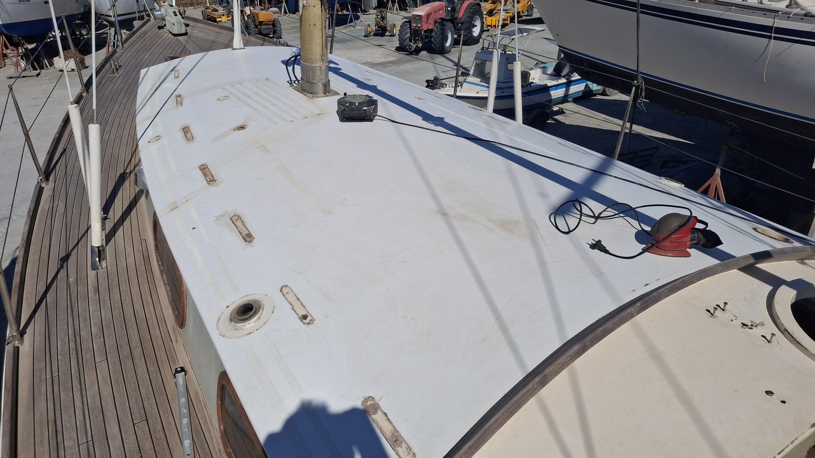 Sanding and preparation work on a sailboat's coachroof
