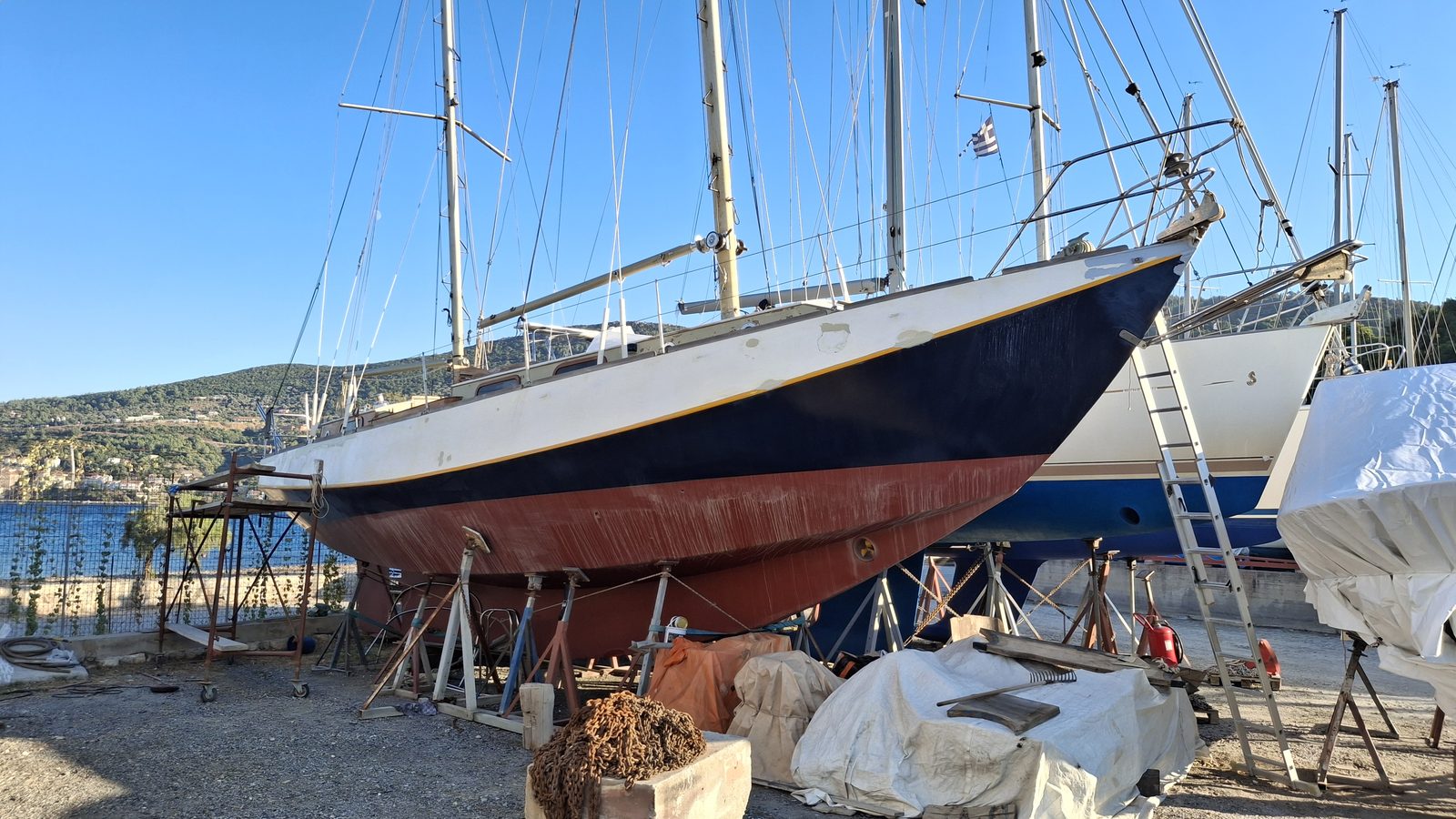 Kon-Tiki sailboat on stands in the boatyard, side view
